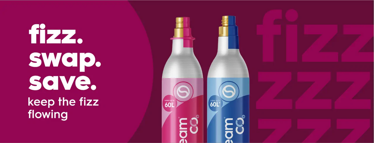 Two CO2 cylinders, one pink and one blue, on a dark pink background with the text "fizz. swap. save. keep the fizz flowing" on the left side.