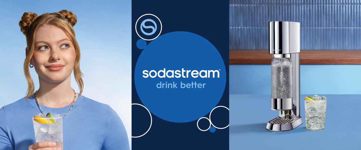 Person holding a glass of sparkling water beside a Sodastream sparkling water maker, with the text “Sodastream drink better”