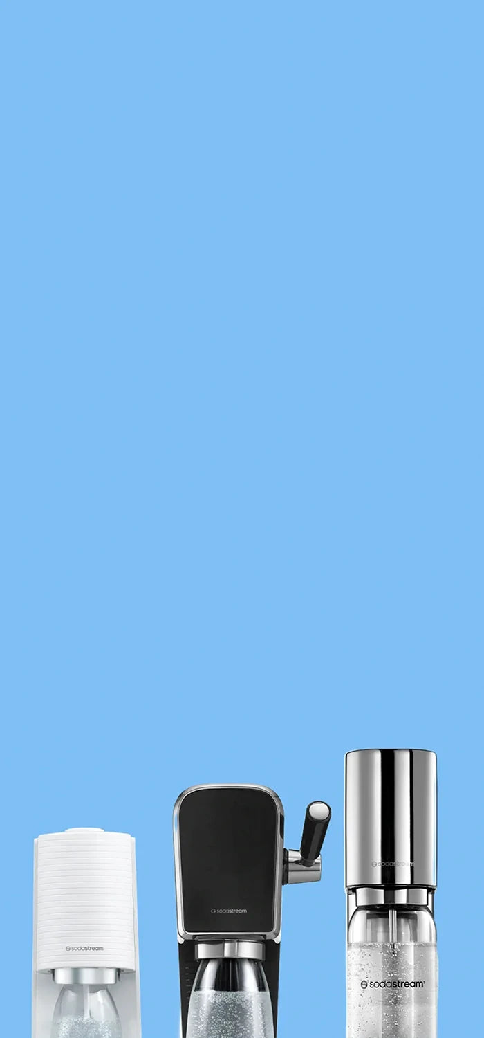 White TERRA, black ART and stainless steel ENSO Sodastream sparkling water makers on a light blue background