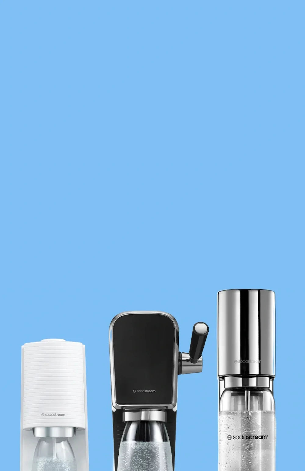 White TERRA, black ART and stainless steel ENSO Sodastream sparkling water makers on a light blue background