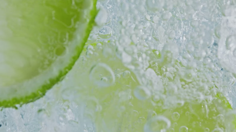 Looped video of sparkling water bubbles up close.